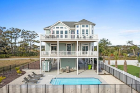 Coastal Charm Ocean Isle Beach custom beach home with 4 bedroom, 3 bath home with pool and elevator